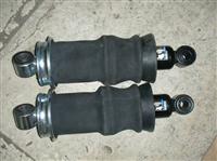 Capsule shock absorber for heavy duty trucks